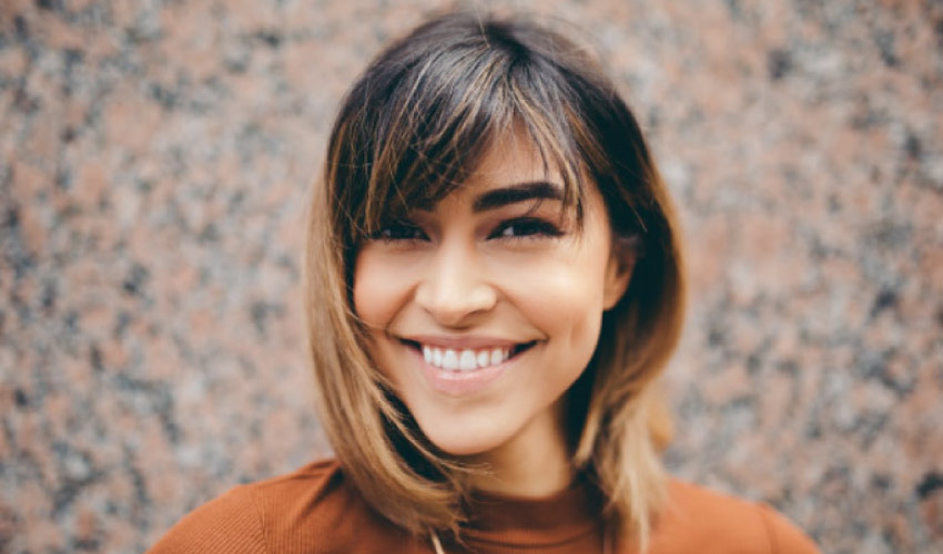 brown haired girl with a big smile