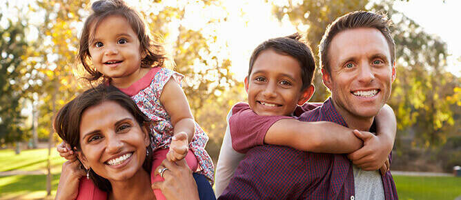 Family smiling after invisalign