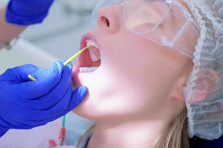 dental patient getting a fluoride treatment